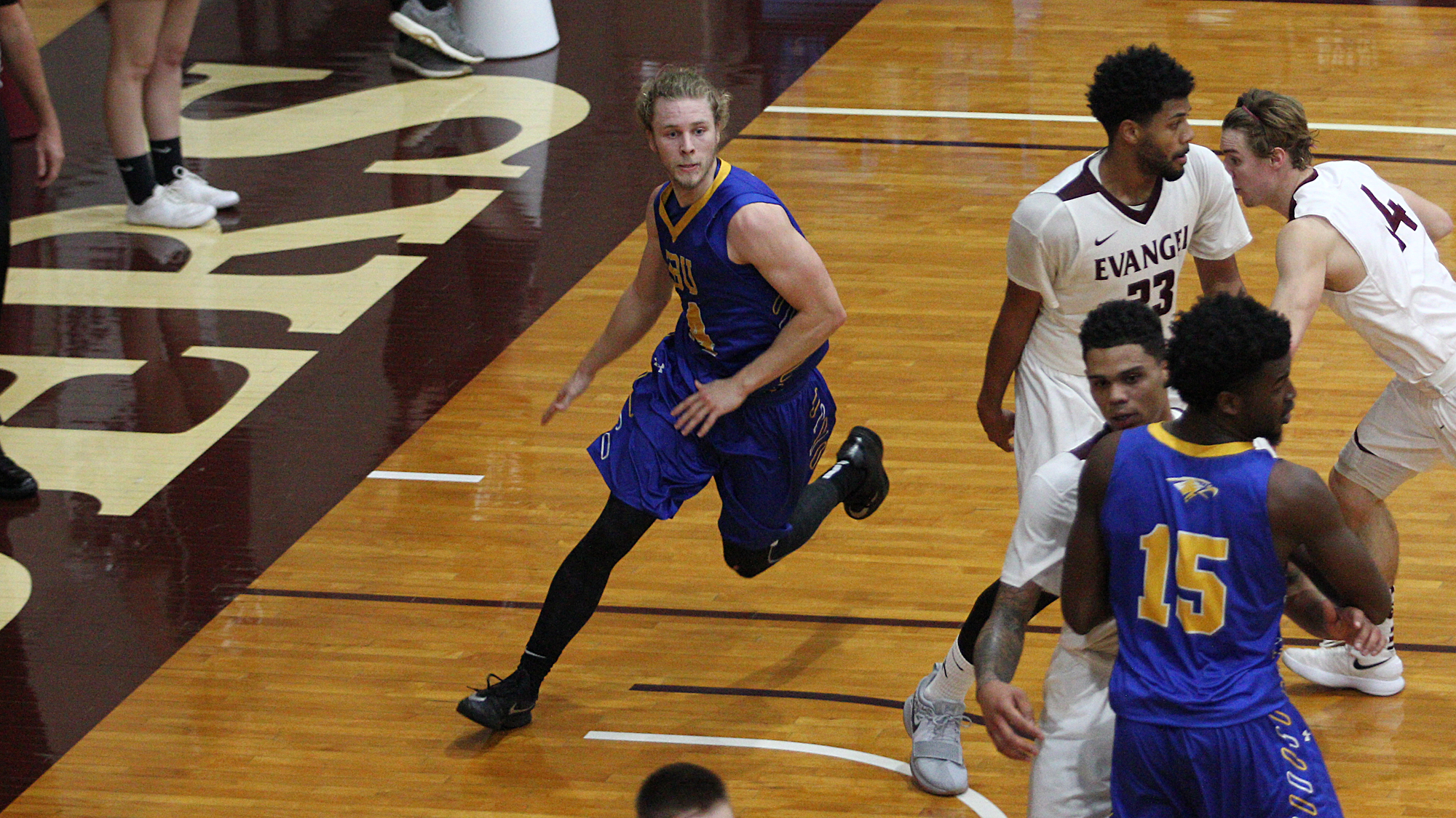 Caudle catches fire, men’s basketball holds on at Evangel